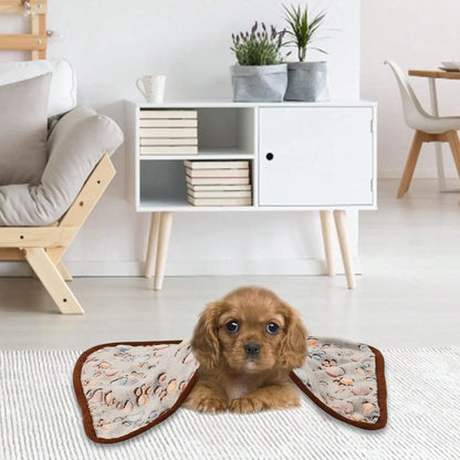 Cavalier King Charles Spaniel puppy lying on a patterned pet blanket