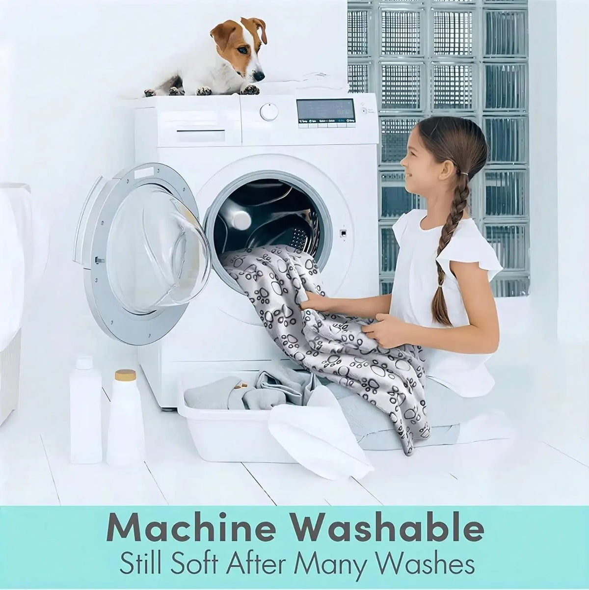 Girl putting a paw print patterned blanket into a washing machine with a dog sitting on top