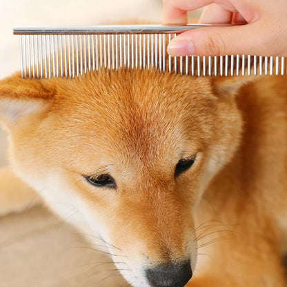 Metal grooming comb brushing the fur of a Shiba Inu dog