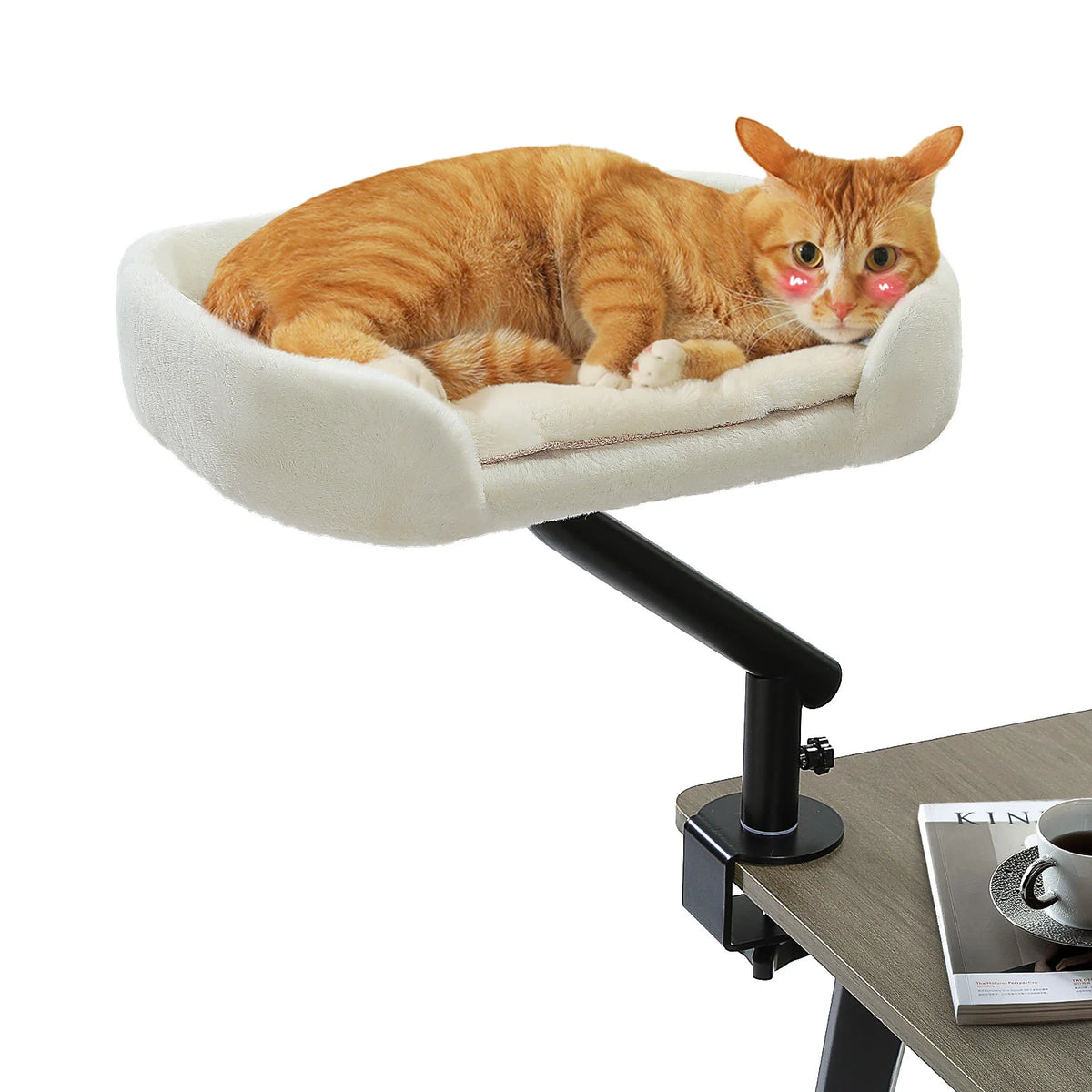 Orange tabby cat lying in a 360 rotating cat desk bed with adjustable hammock basket clamped to a desk