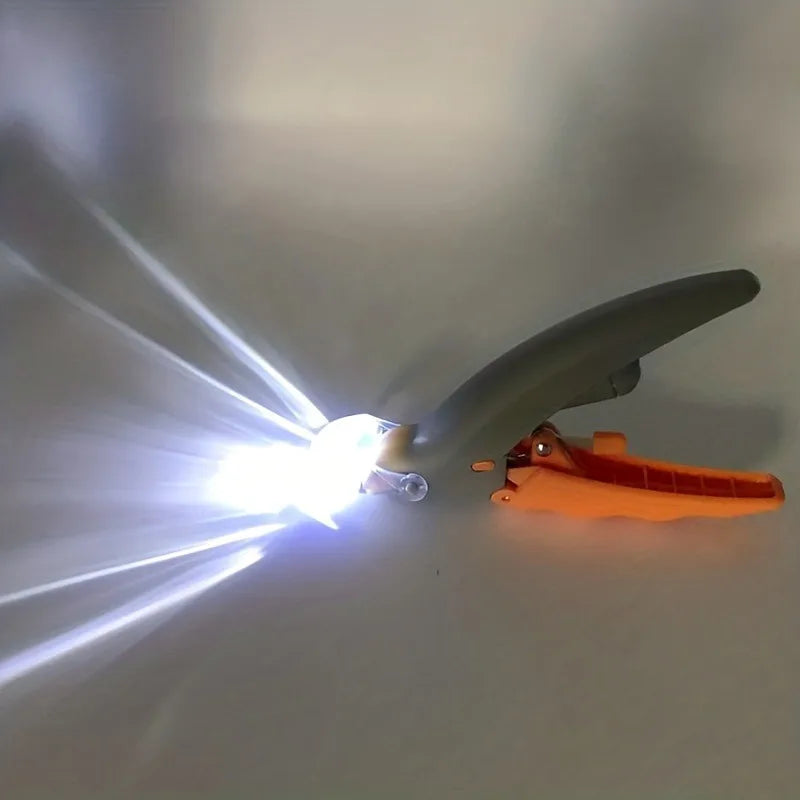 Pet nail clippers with integrated LED light turned on