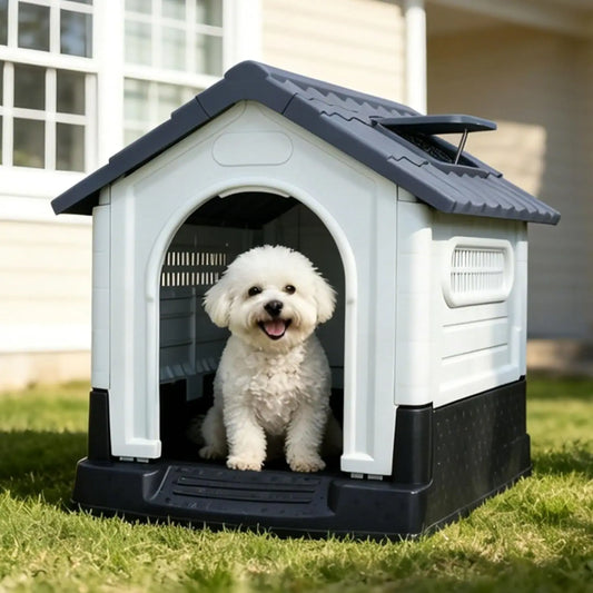 Small white dog sitting inside a grey and white plastic dog house on a lawn