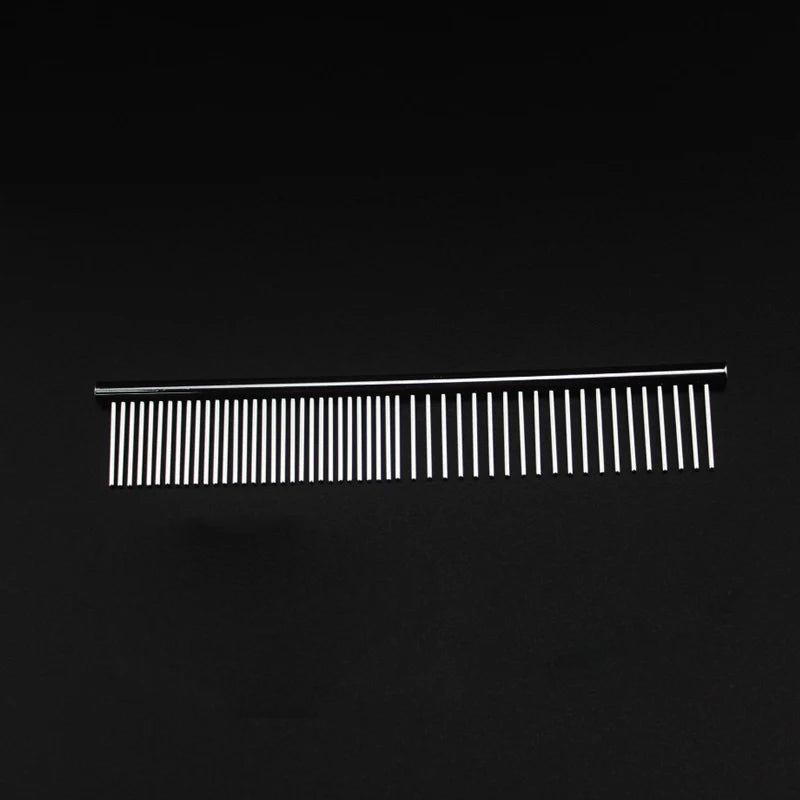 Metal grooming comb with fine and coarse teeth on a black background