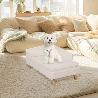Small white dog sitting on a Nordic elevated pet sofa bed with wood legs