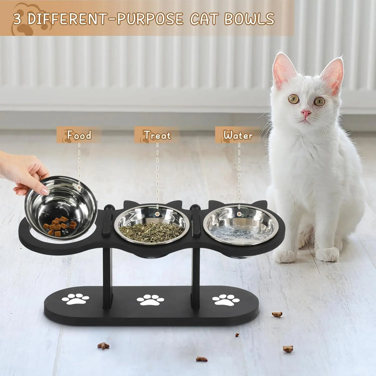 Triple cat bowl stand with stainless steel bowls for food treats and water next to a white cat
