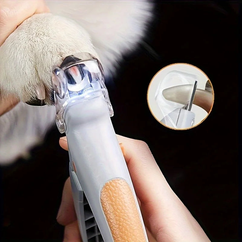 Professional LED pet nail clippers trimming a dog claw with a close up view of the blade